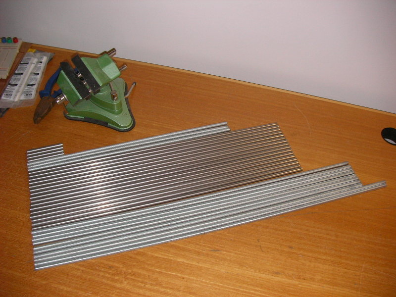 Some cut lengths of steel on a table
