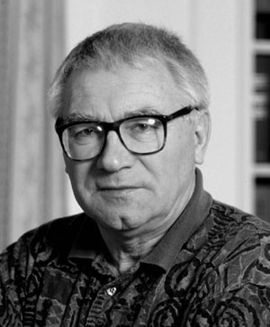 A black and white picture of George Kukla, an old man wearing glasses